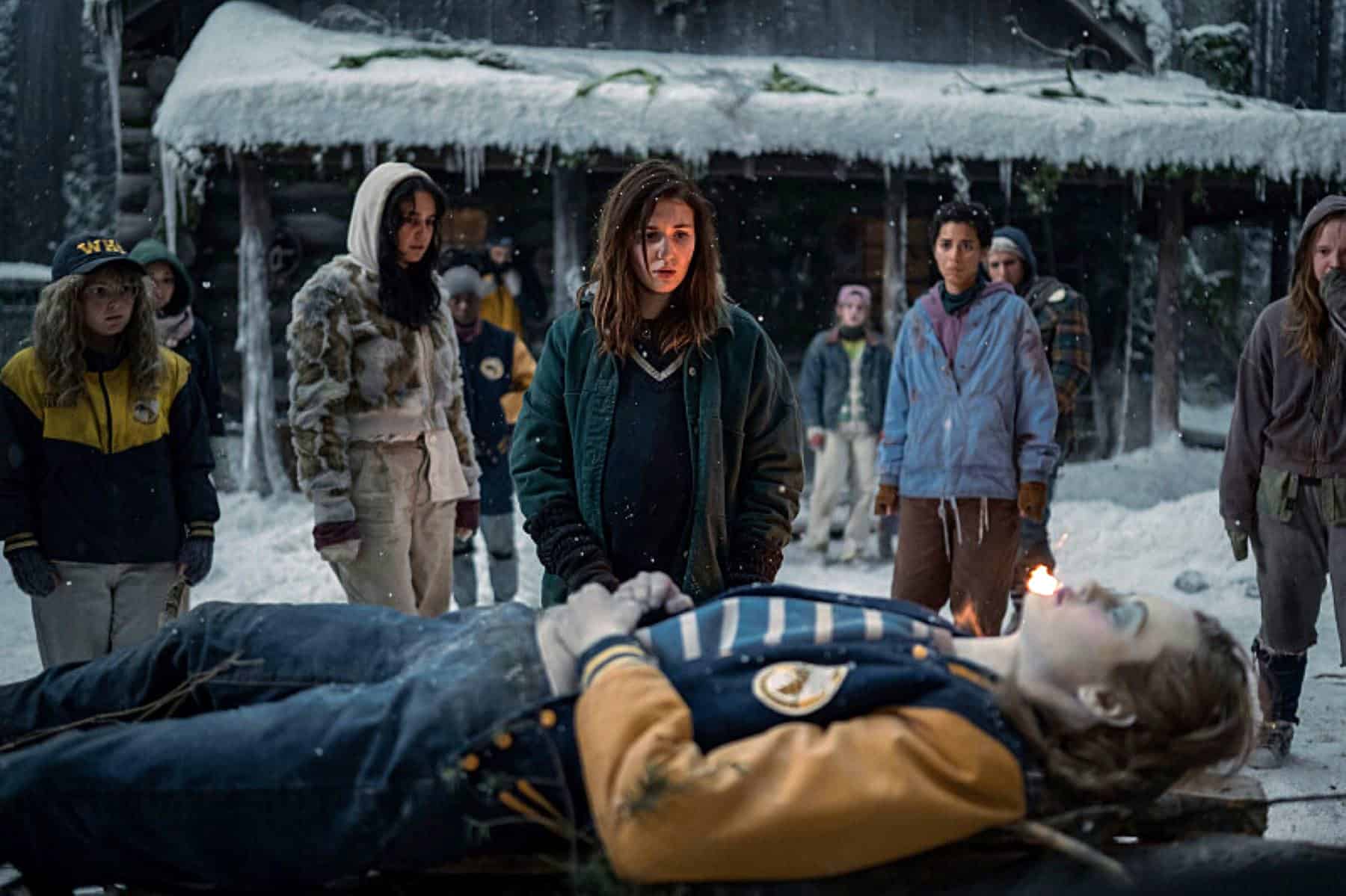 A group of teenagers stand behind a girl’s corpse in this photo by Showtime.