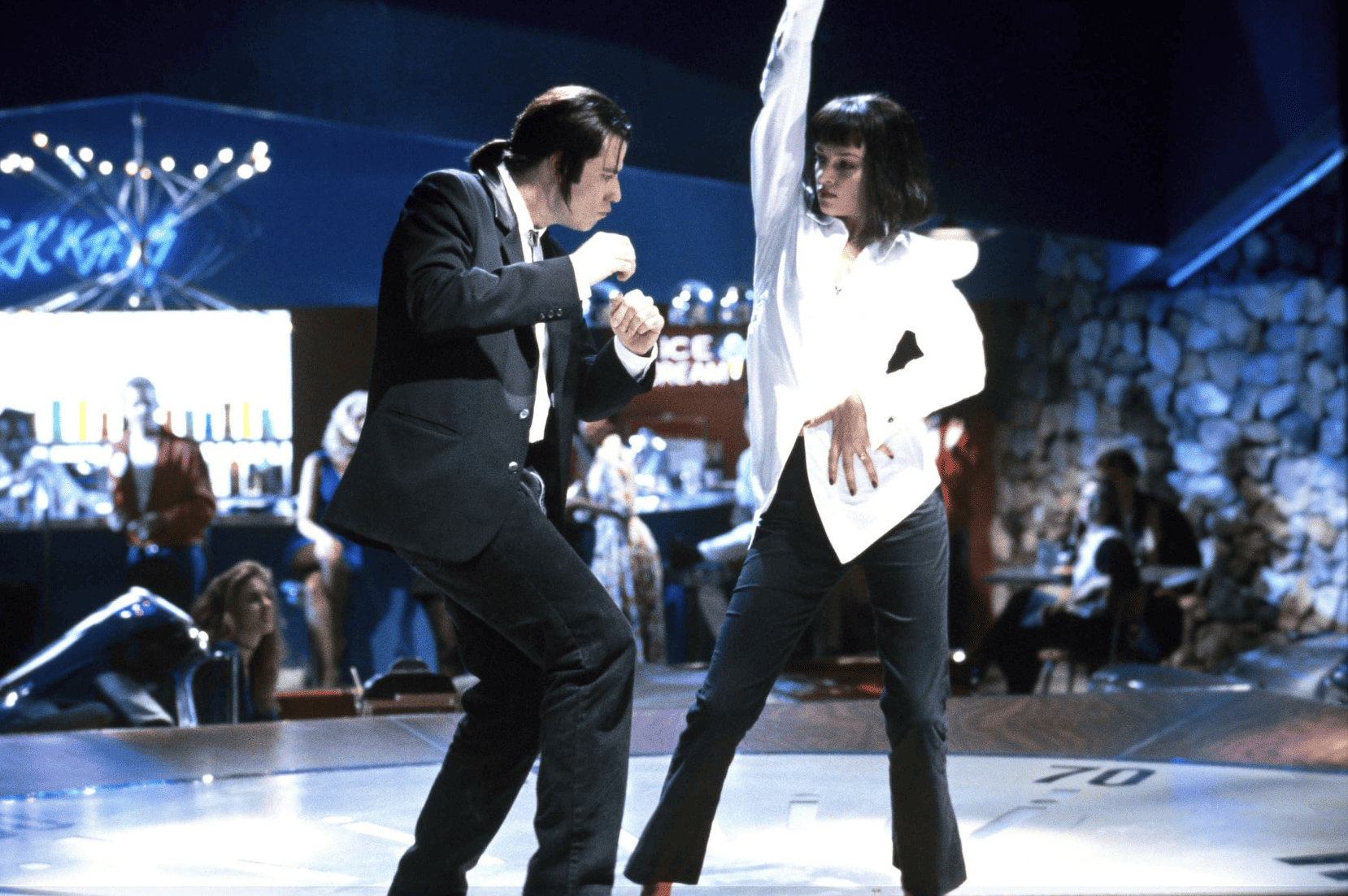 A man and a woman dance at a nightclub in this image from Miramax.