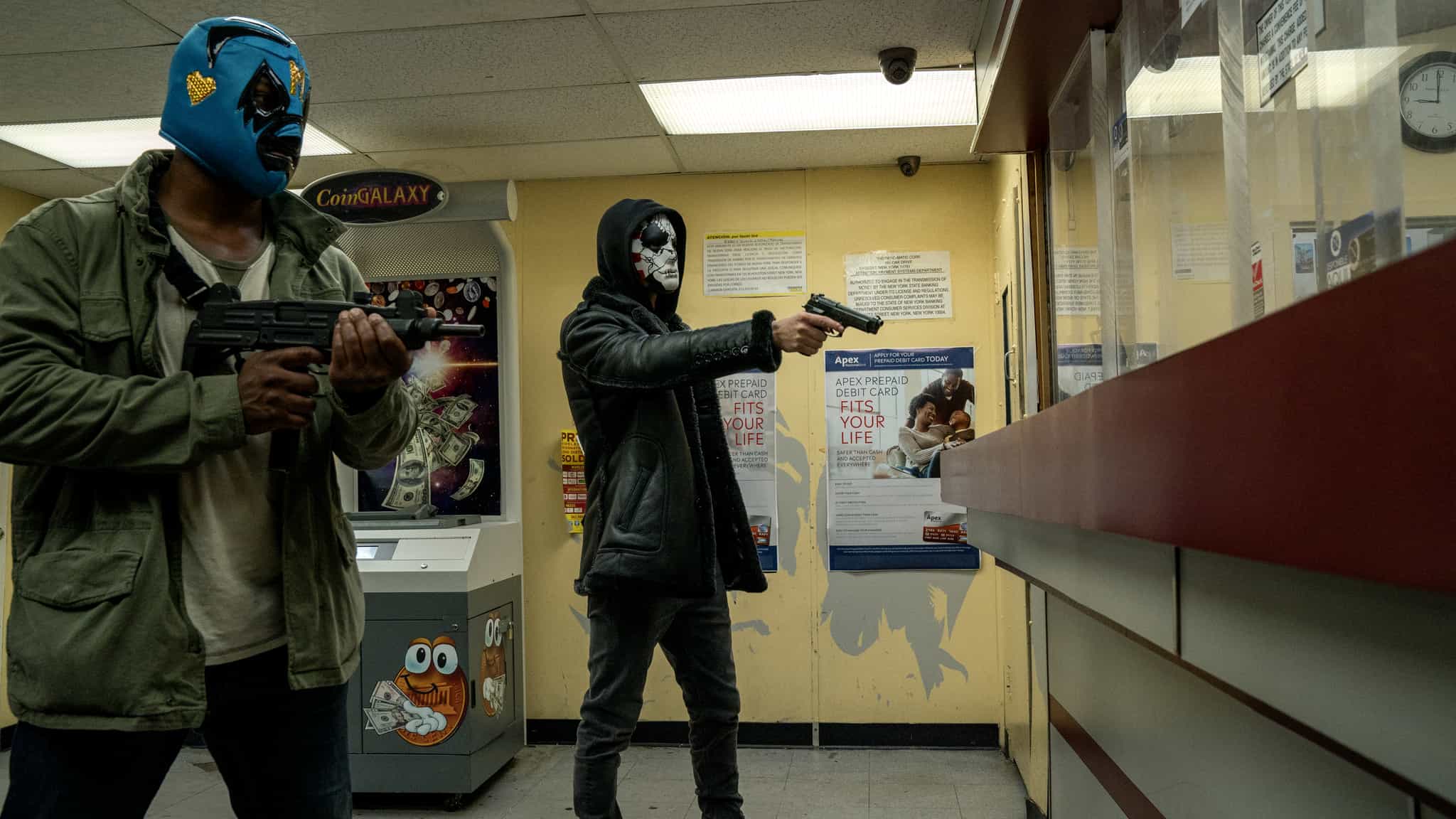 Two masked men holding up a bank in this image from ABC Studios.
