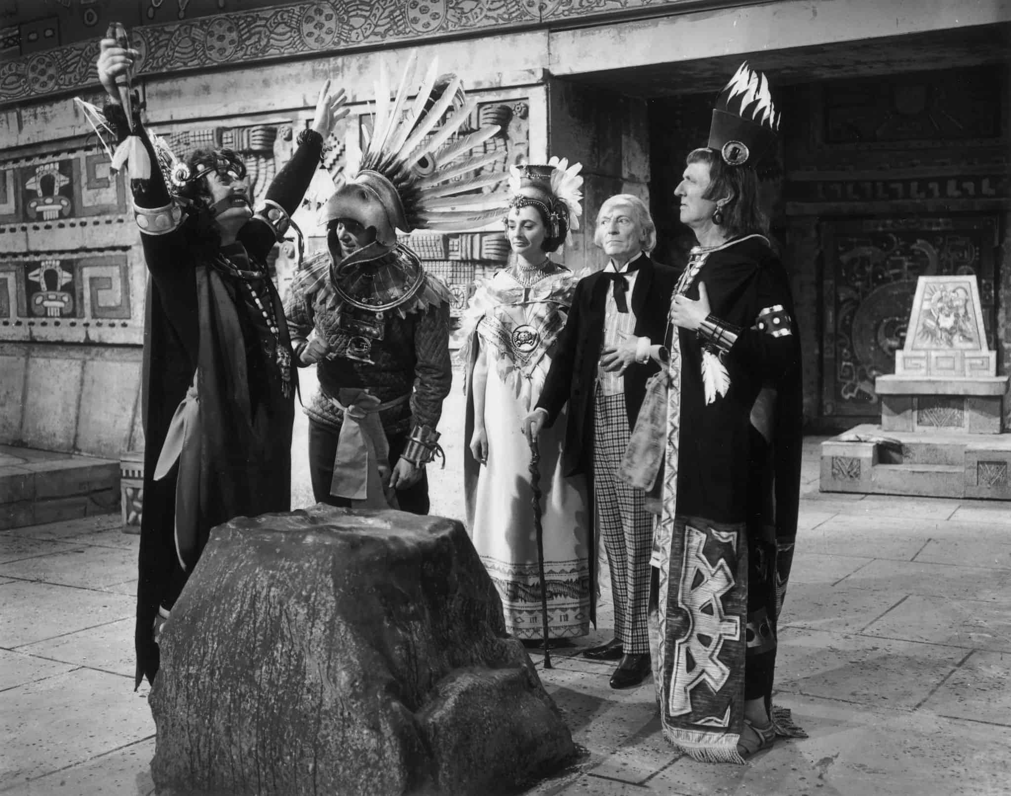 A man stands with Aztecs in a temple in this photo from British Broadcasting Corporation.