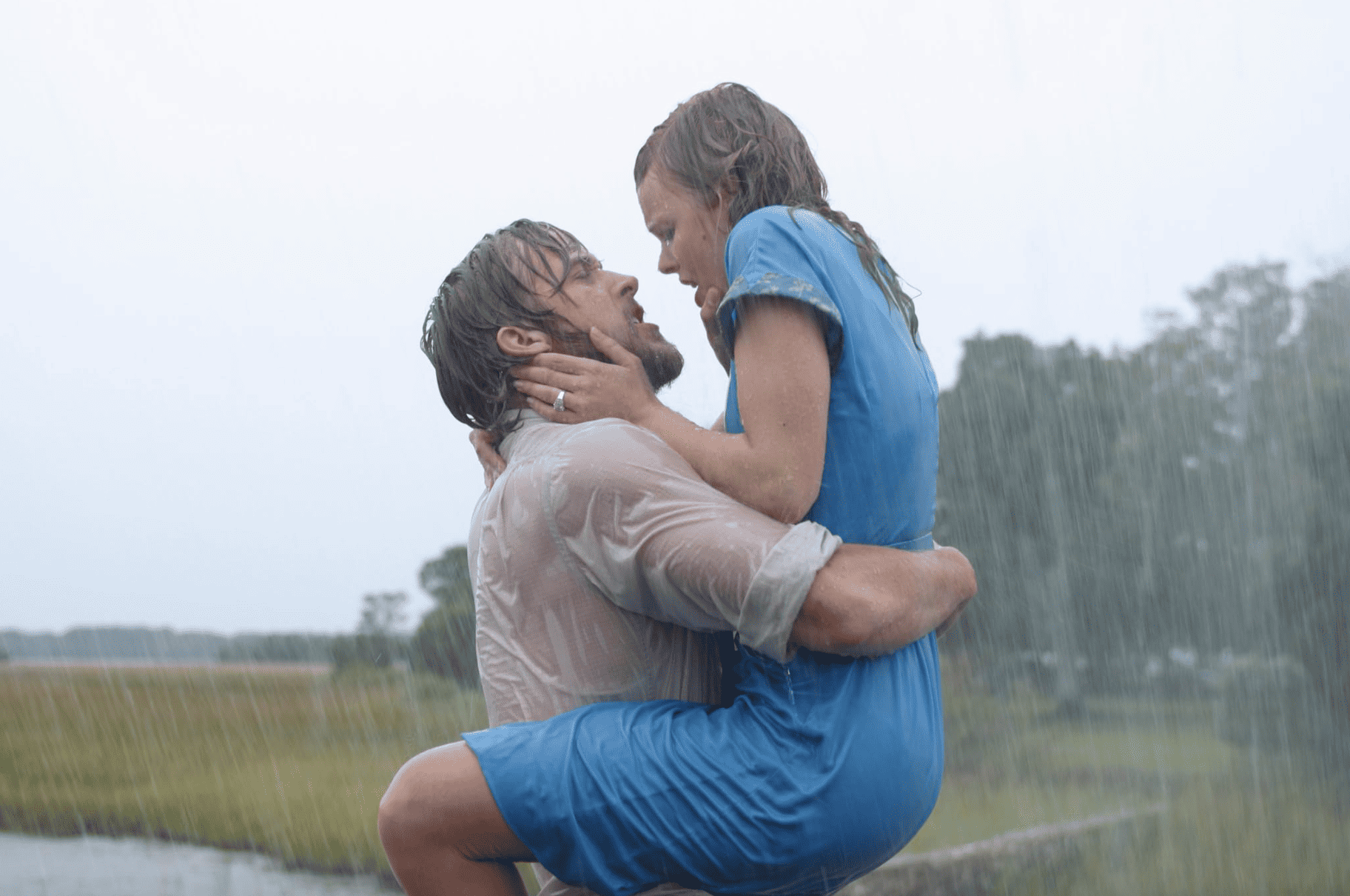  A man holds up a woman in the rain in this image from New Line Cinema.