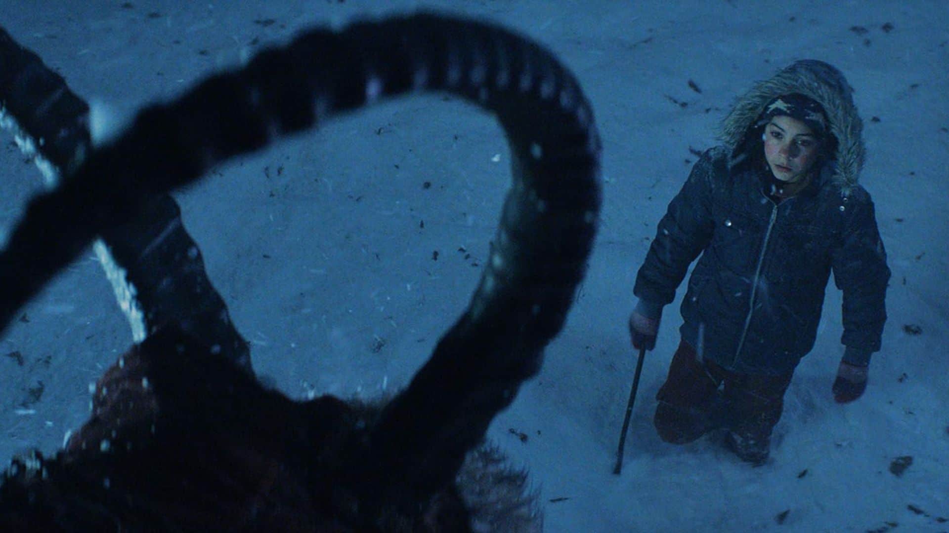  A boy looks up at Krampus in this image from Legendary Pictures.