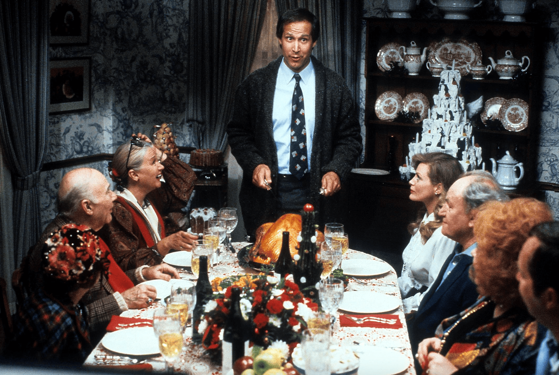 A dysfunctional family gathers around the dinner table in this image from Warner Bros.
