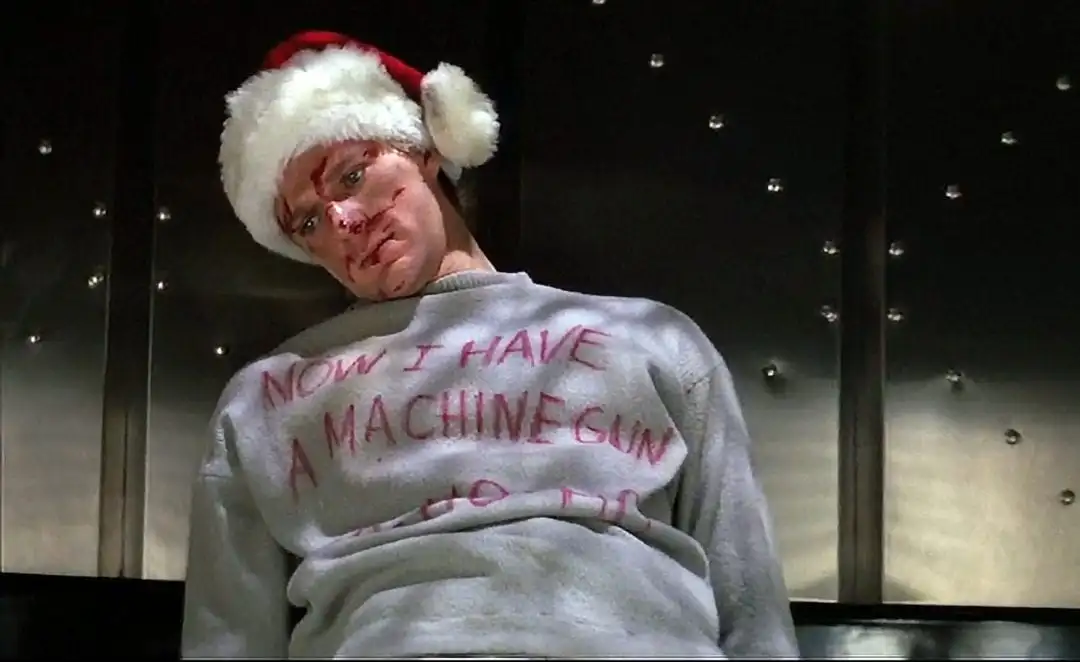 A man lies dead wearing a Santa hat in this image from Silver Pictures.