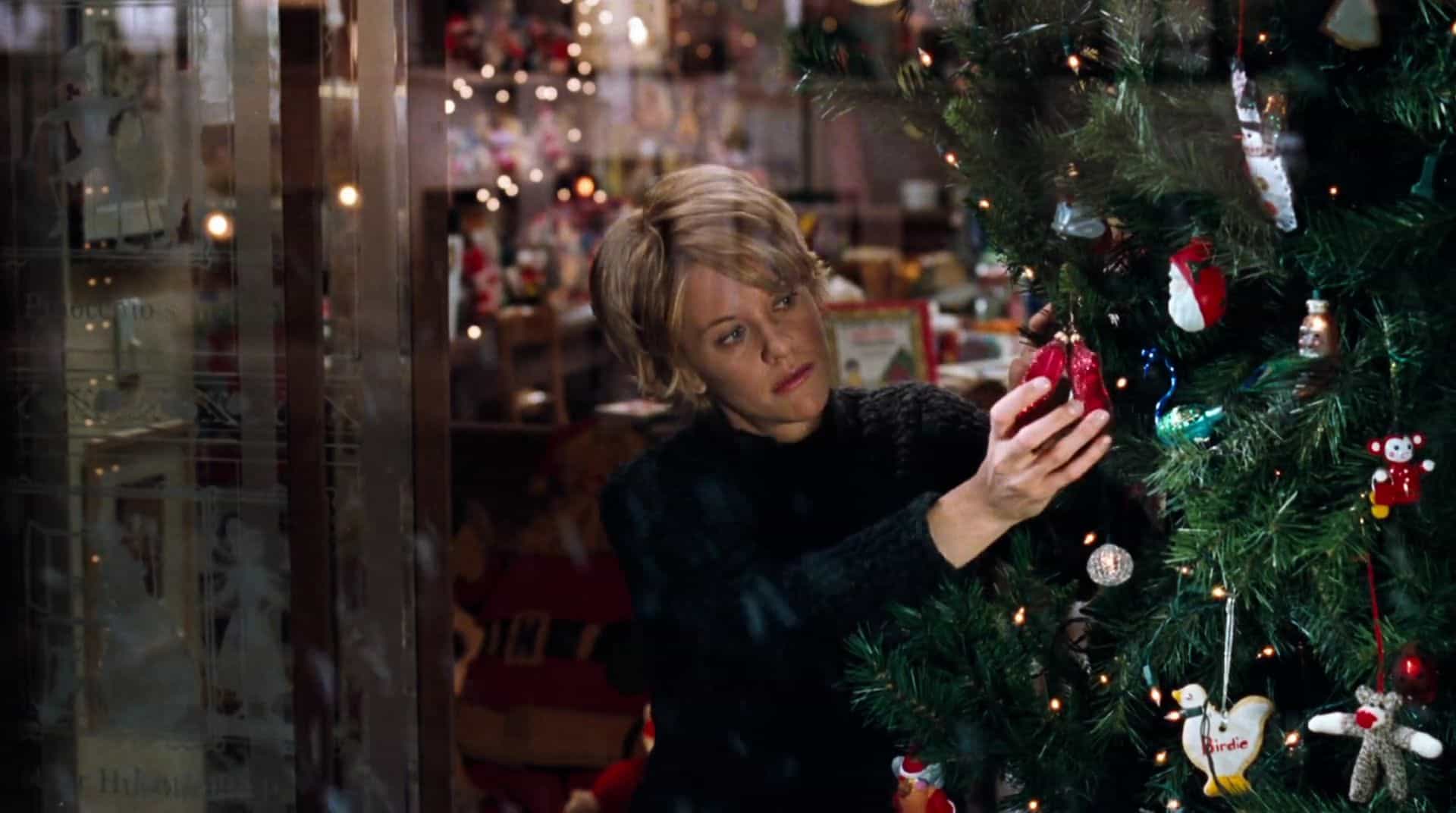 A woman decorates a Christmas tree in this image from Lauren Shuler Donner Productions.