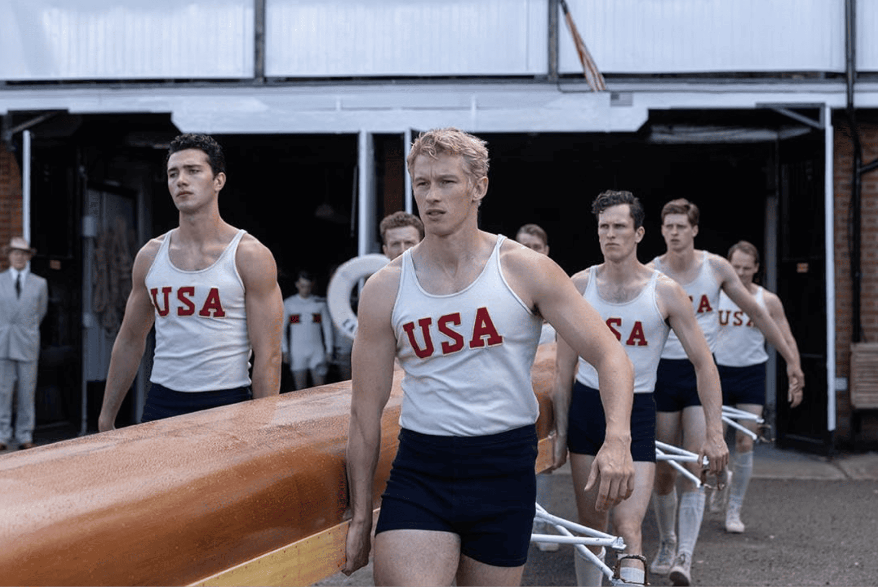 A group of young men in USA shirts carry a boat in this image from Metro-Goldwyn-Mayer.