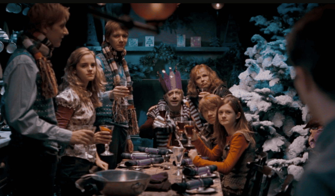 A family raises their drinking glasses to make a toast on Christmas in this image from Warner Bros. Pictures.