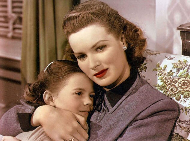A vintage mother and daughter hugging in this image from Twentieth Century Fox