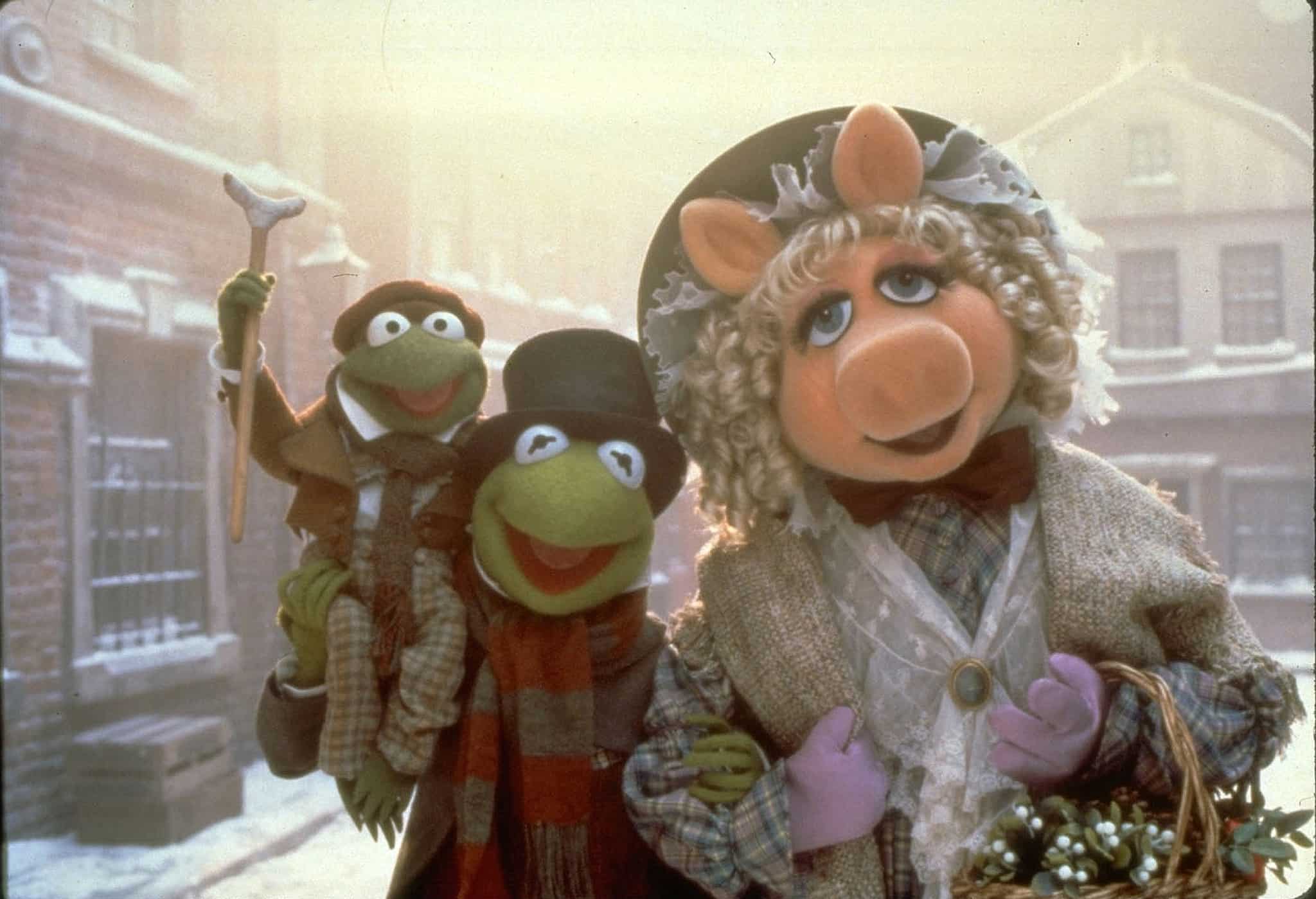 Robin the Frog, Kermit the Frog, and Miss Piggy in Victorian dress in this image from Jim Henson Productions.