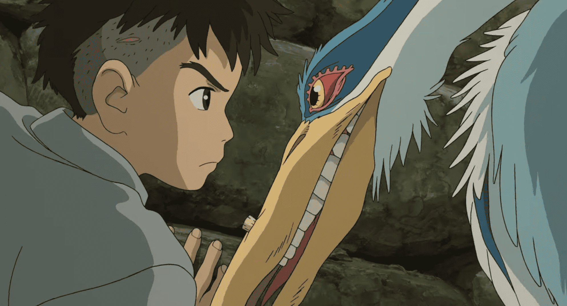 An animated boy and a heron glare into each other's eyes in this image from Studio Ghibli.