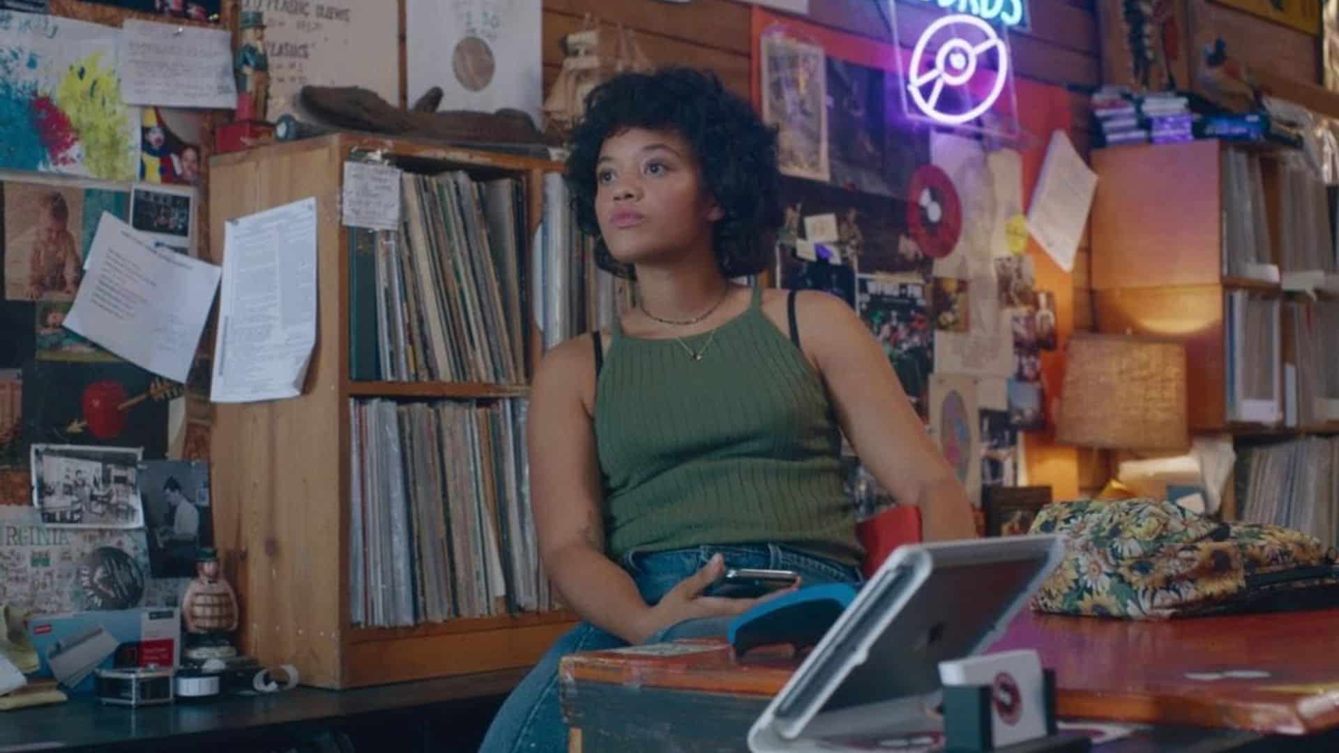 A woman working the counter of a record store in this image from Burn Later Productions.