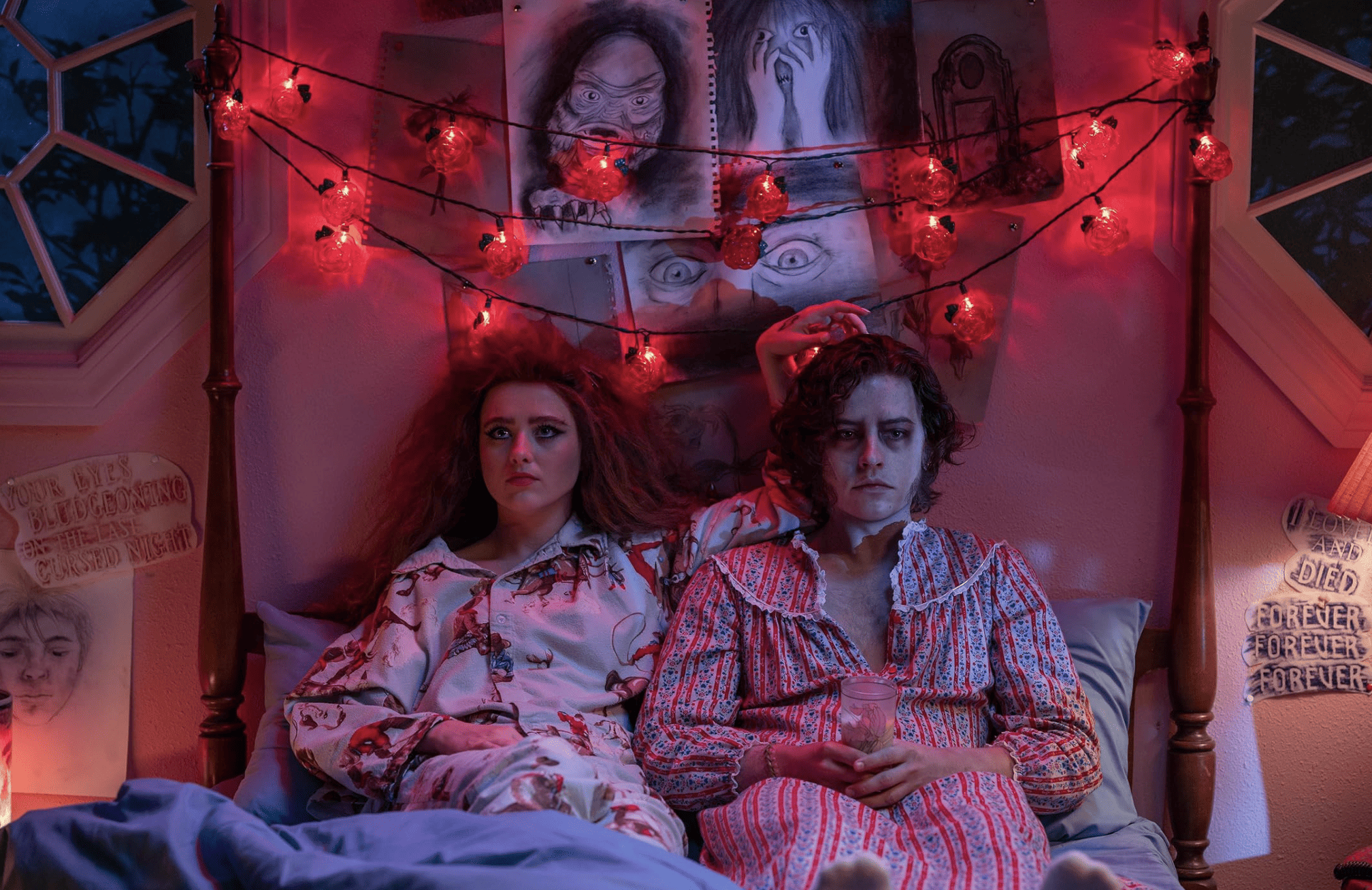 A teenage girl and boy sit on a bed in pajamas in this image from MXN Entertainment.