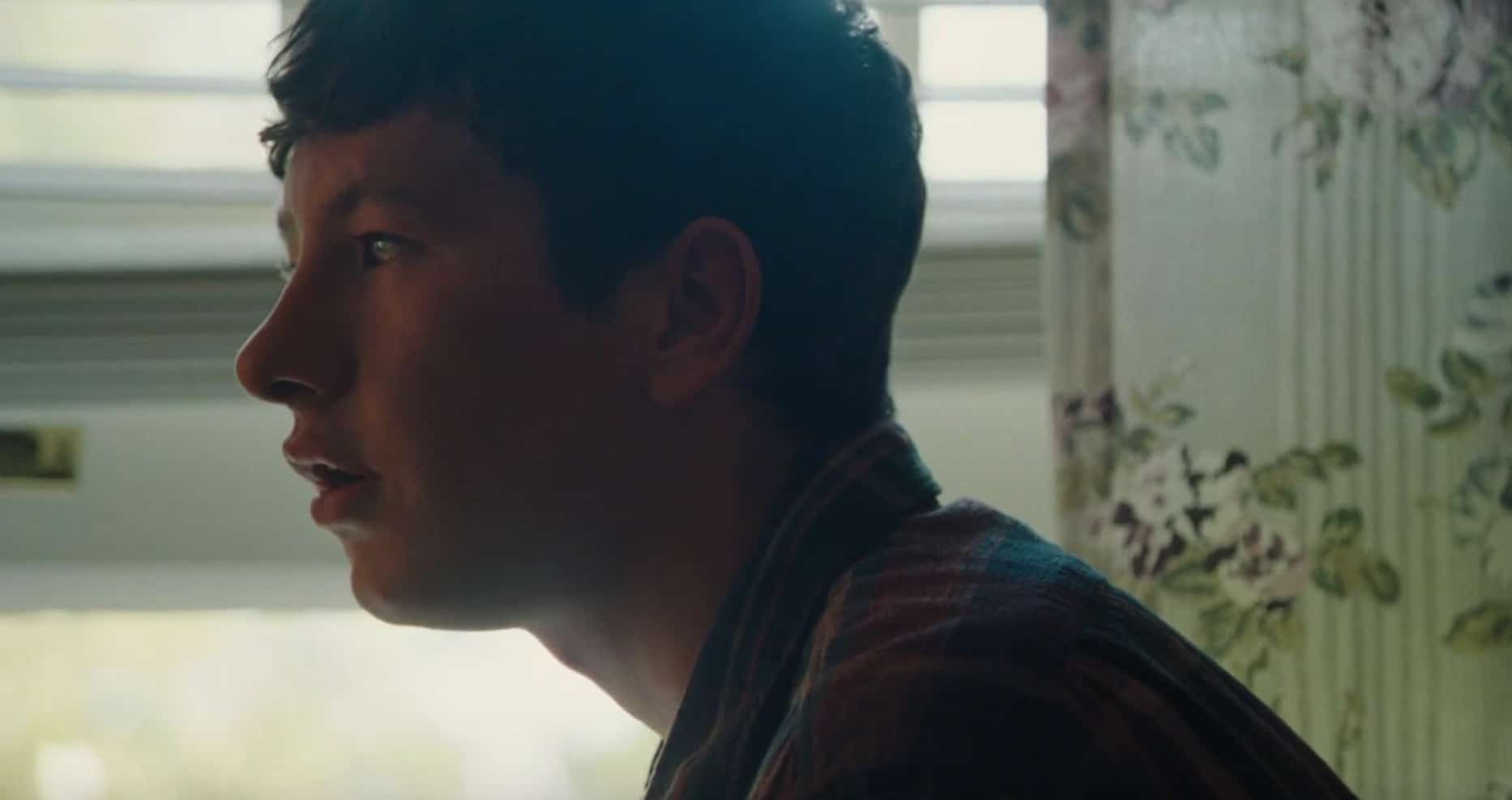 A man listens to something intently in front of a window in this image from Element Pictures.
