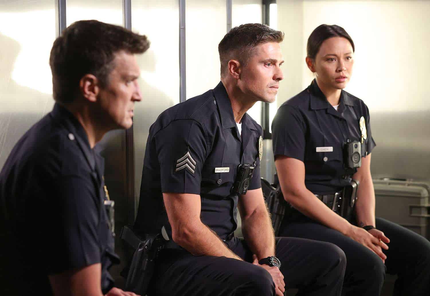 Three cops sit in a surveillance van in this image from ABC Signature.
