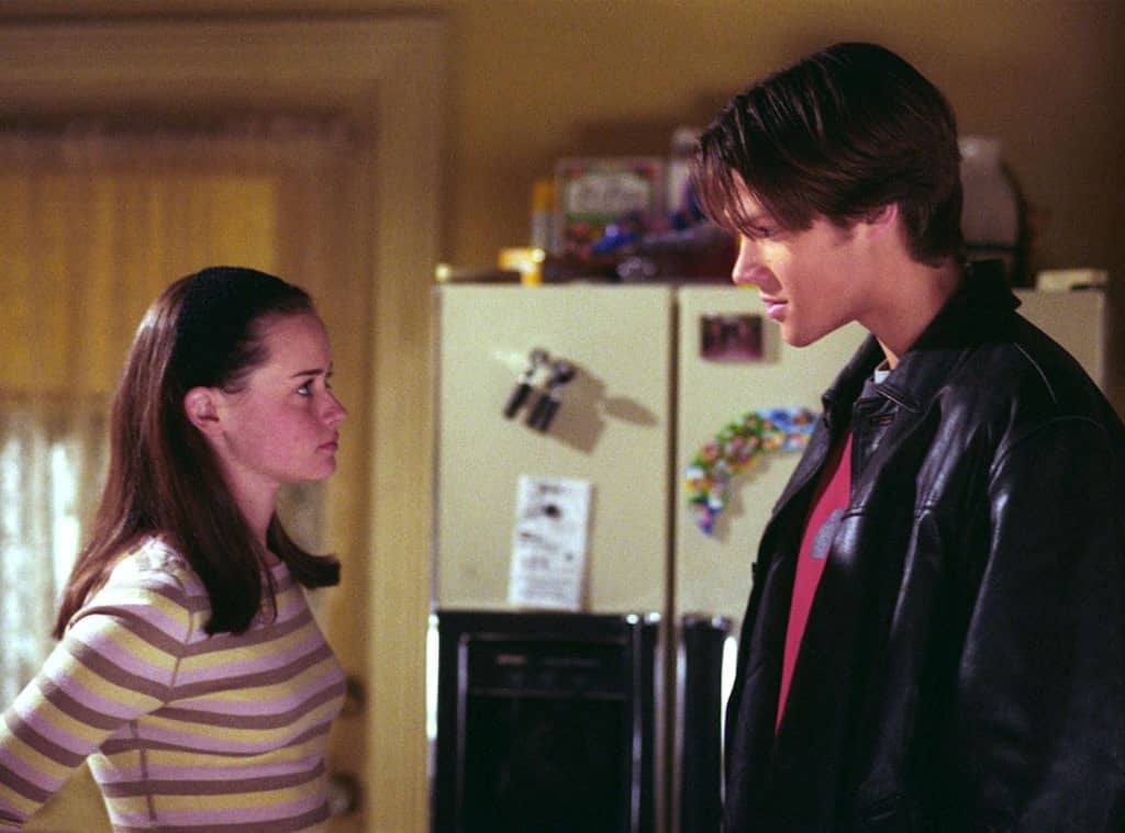 A young couple argues in a kitchen in this image from Warner Bros. Television.
