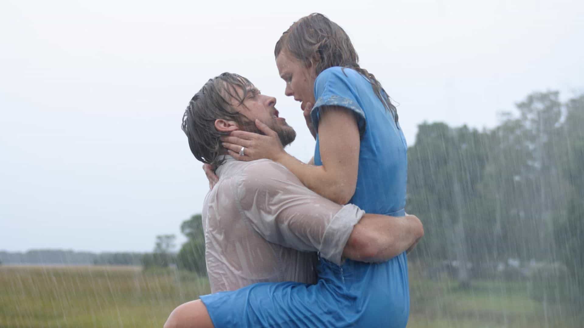 A man embraces a woman in a blue dress while standing in the rain in this image from New Line Cinema.