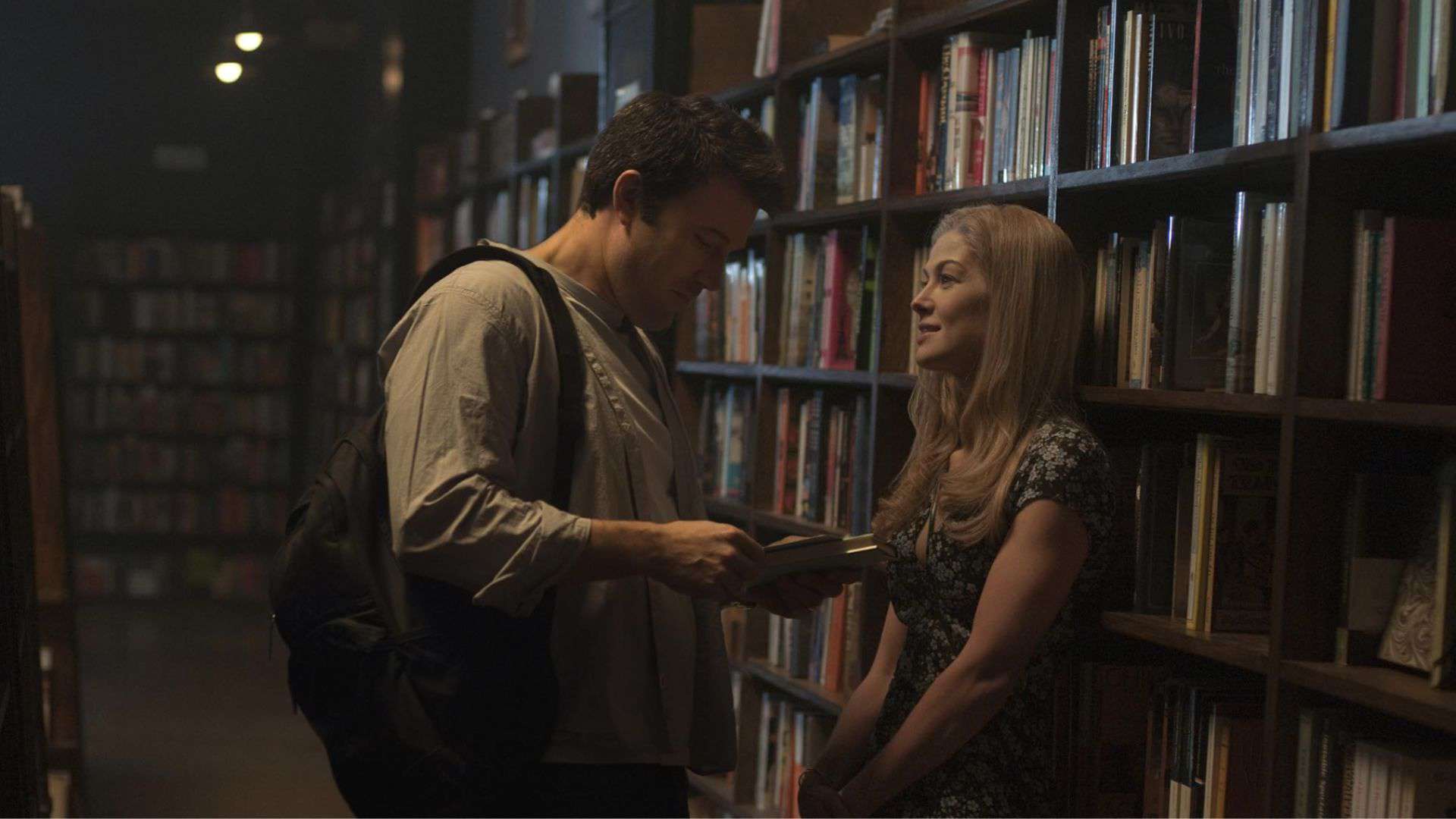 A man flirts with a woman in a library in this image from 20th Century Fox.