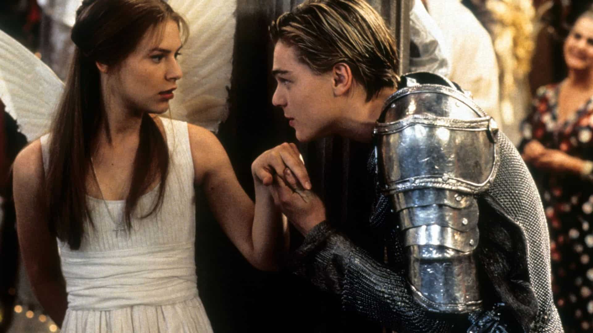 A teen boy in armor kisses the hand of a girl with angel wings in this image from Bazmark Films.