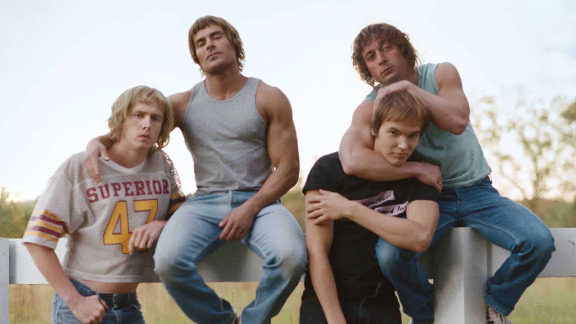 Four brothers pose together on a fence in this image from A24.