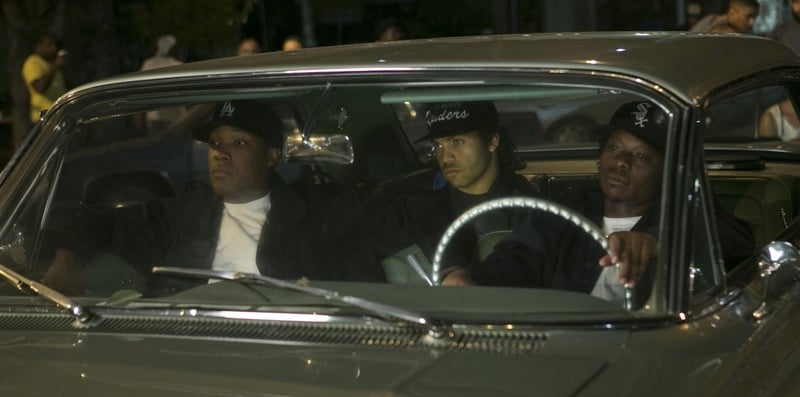 Three men sit in a car at night in this image from Legendary Pictures.