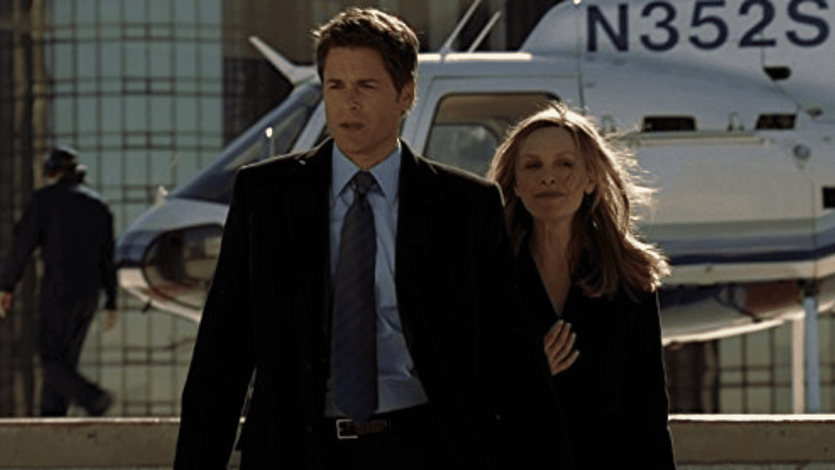A couple walks arm in arm away from a helicopter in this image from Berlanti Television.