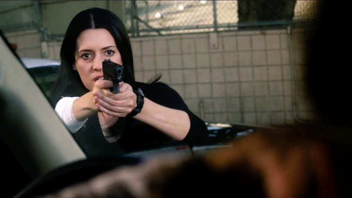 A woman draws a gun in this image from Entertainment One.