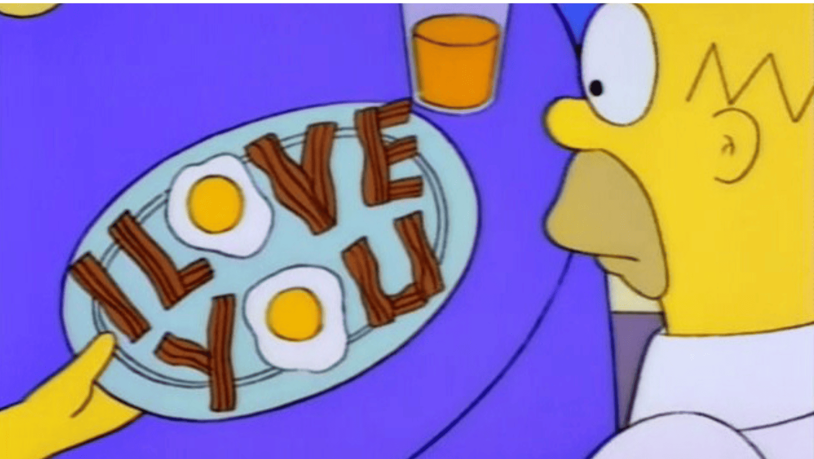 A plate of eggs and bacon spells “I Love You” in this image from Gracie Films.