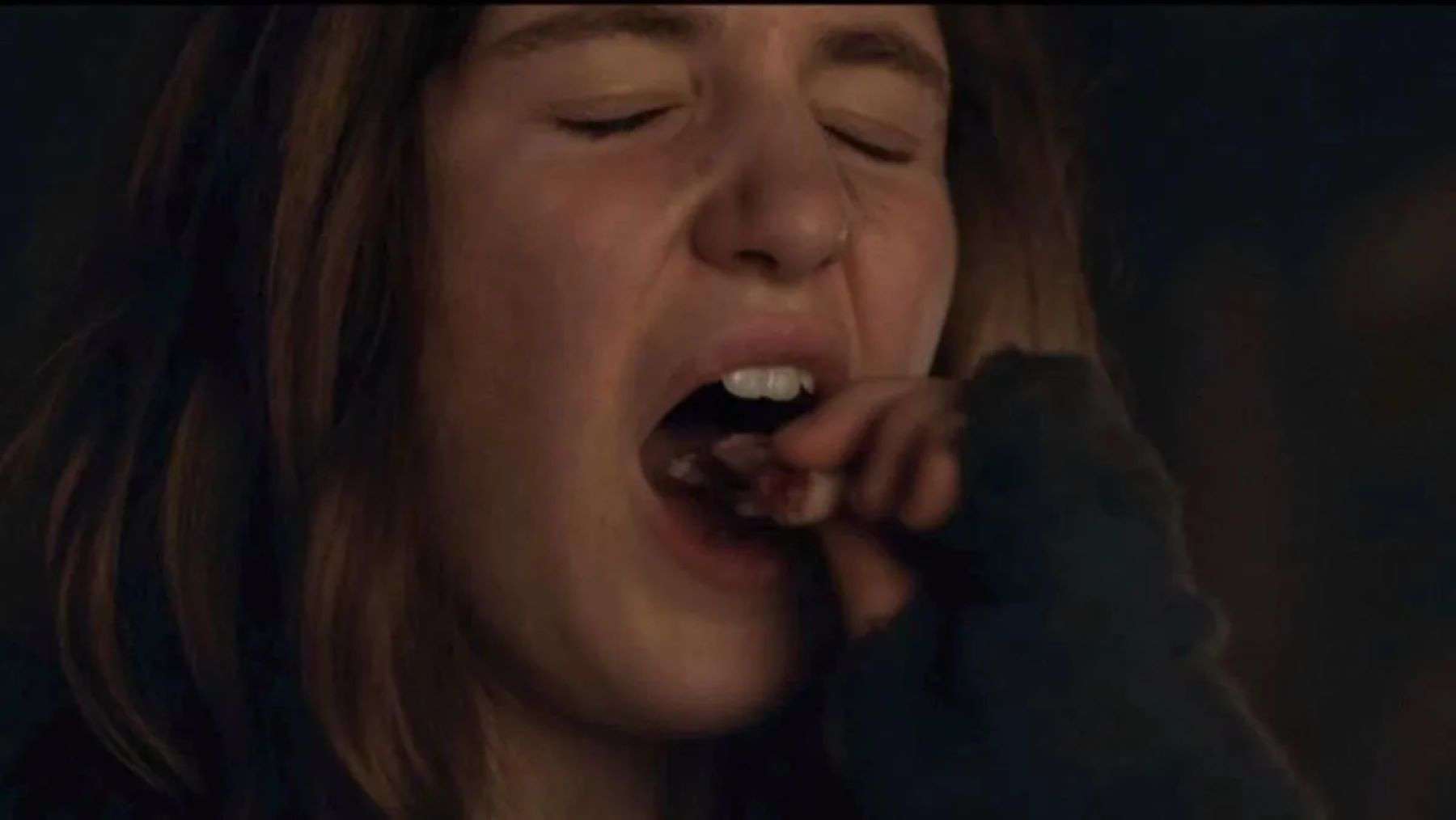 A girl puts something in her mouth in this photo by Showtime.