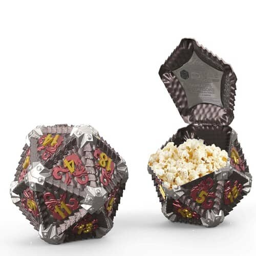Two 20-sided dice, one popped open to reveal popcorn in this image from AMC.