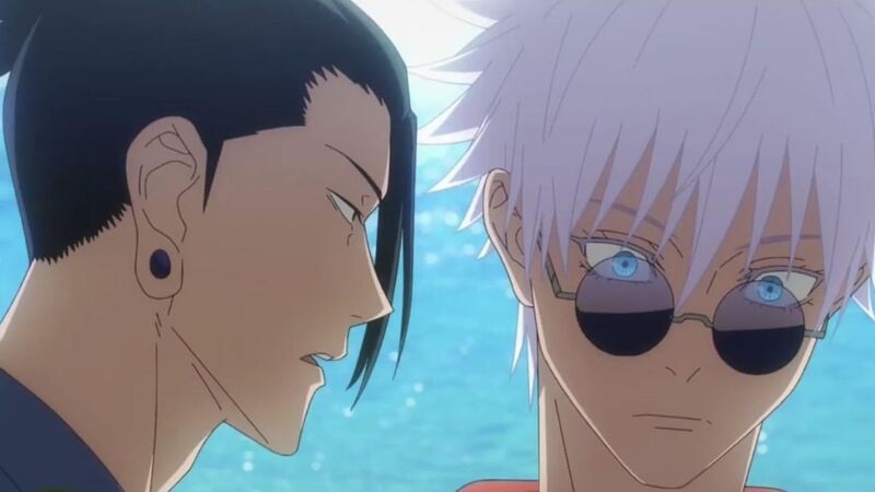 A close-up of an animated man with dark hair talking to a man with white hair and blue eyes in this image from MAPPA.