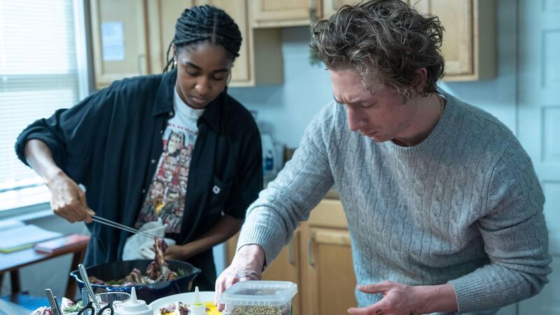 A woman and man cooking in an apartment kitchen in this image from FX Productions.