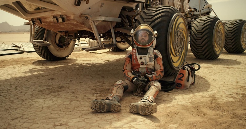 An astronaut rests by his rover in this image from Scott Free Productions.
