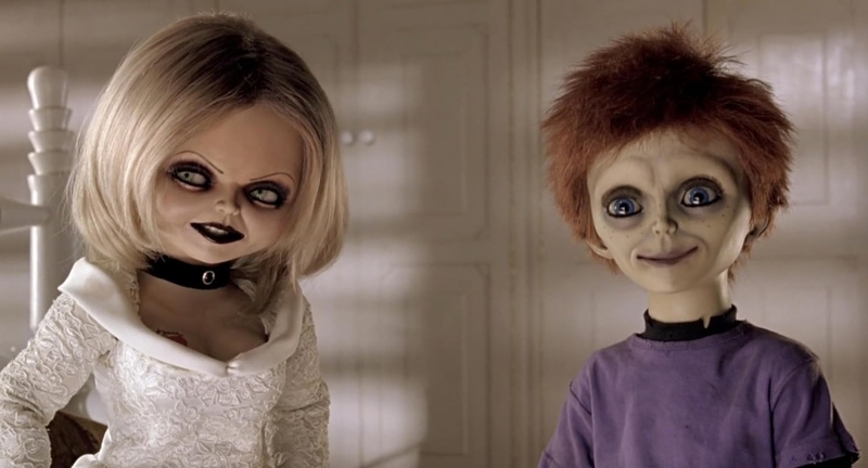 Two living dolls stand together in this image from La Sienega Productions.