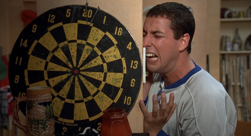 A man in a sports jersey wails into his apartment intercom in this image from Universal Pictures.