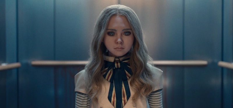 A robot doll disguised as a young girl stands on an elevator in this image from Universal Pictures.