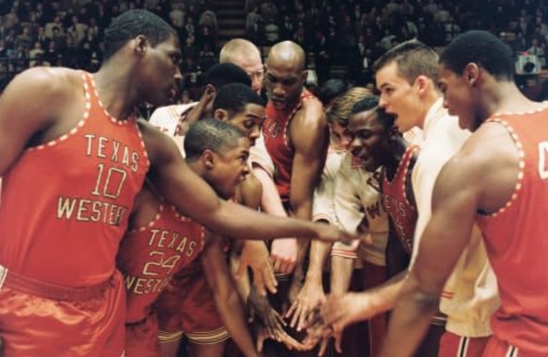 A basketball team rallies themselves in a huddle in this image from Walt Disney Pictures.
