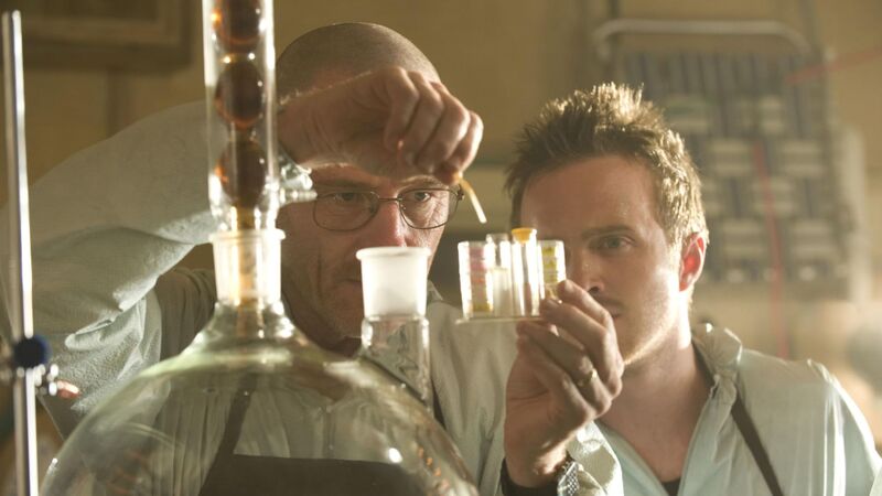 Two men examining a chemical reaction in this image from High Bridge Productions.