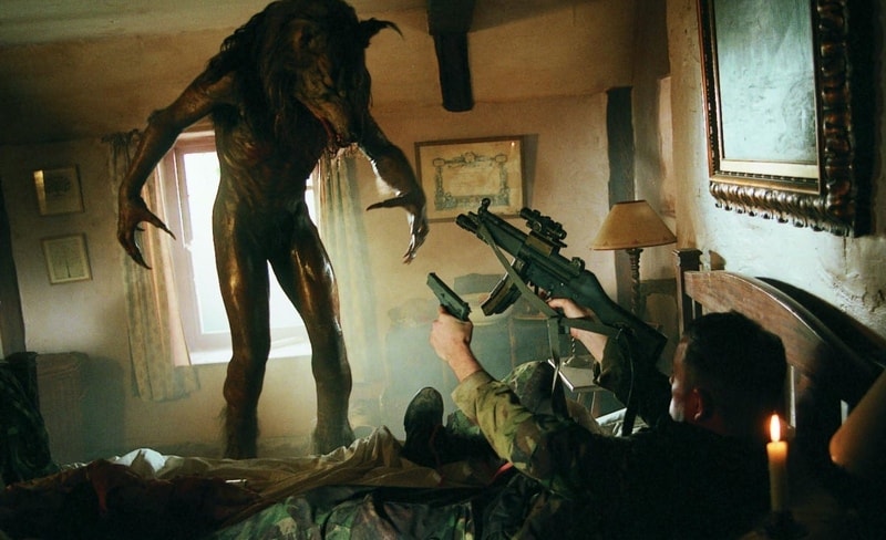 A soldier points two guns at a werewolf in this image from Kismet Entertainment Group.