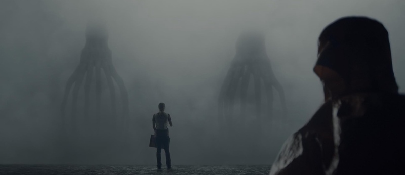 A woman stands in front of two multilegged aliens in this image from FilmNation Entertainment.