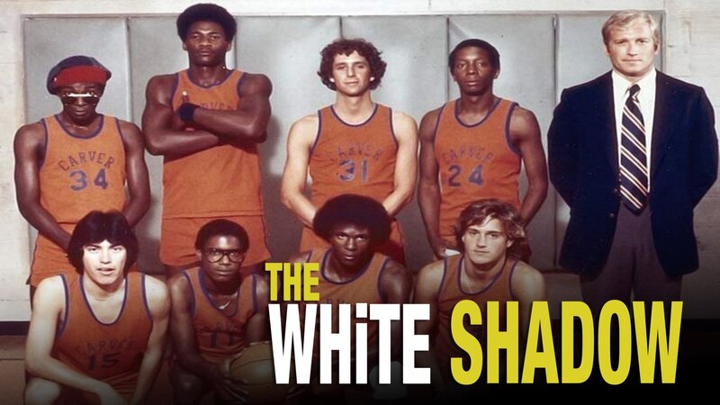 A group of basketball players and their coach pose for a photo in a gym in this image from Company Four.