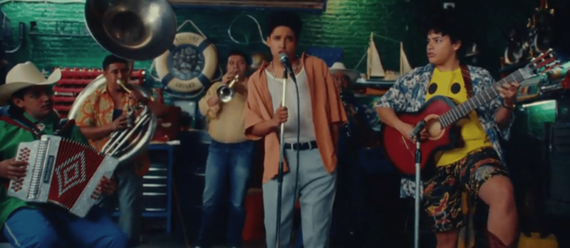 A band plays music in an auto shop in this image from Alebrije Cine y Video.