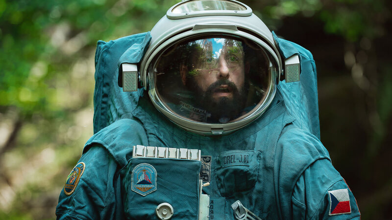 A man stares through his astronaut visor in awe of his surroundings in this image from Free Association.