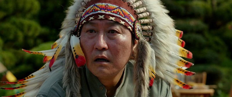 A Korean man in a Native American headdress in this photo from CJ Entertainment.