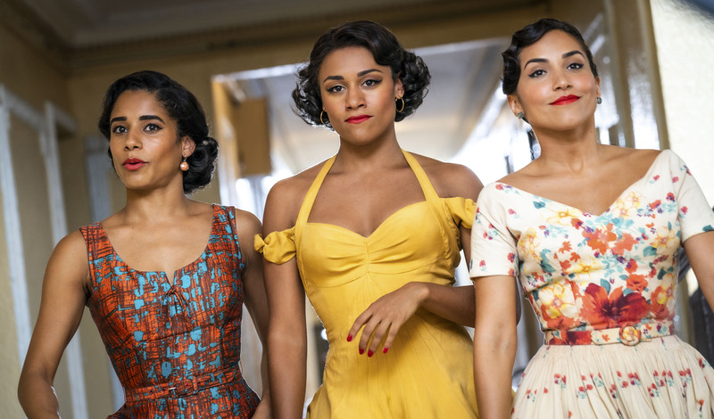 Three women in dresses in this image from Amblin Entertainment.