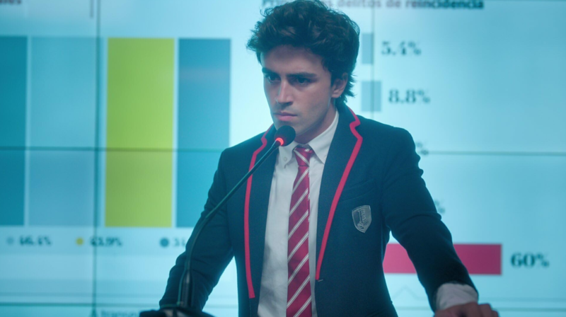 A high school student in uniform gives a presentation in this image from Zeta Producciones.