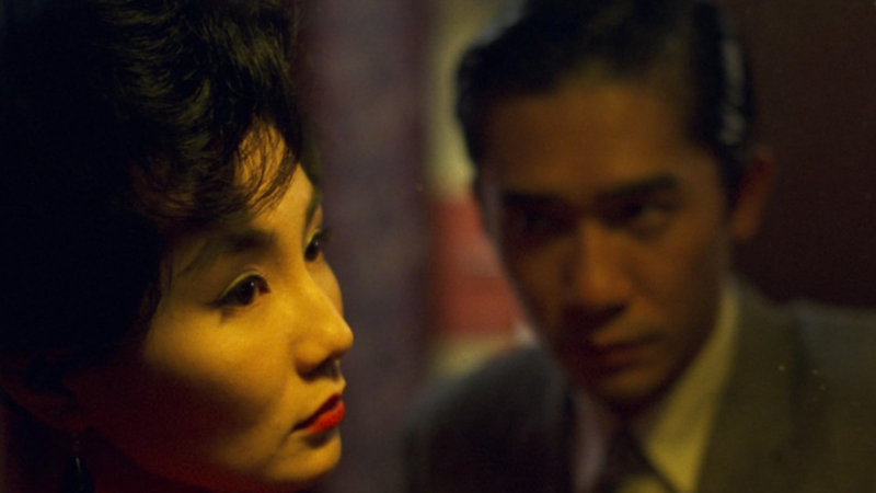 A close-up of a couple in a reflective moment, the woman in focus and the man slightly blurred in the background in this image from Jet Tone Production.
