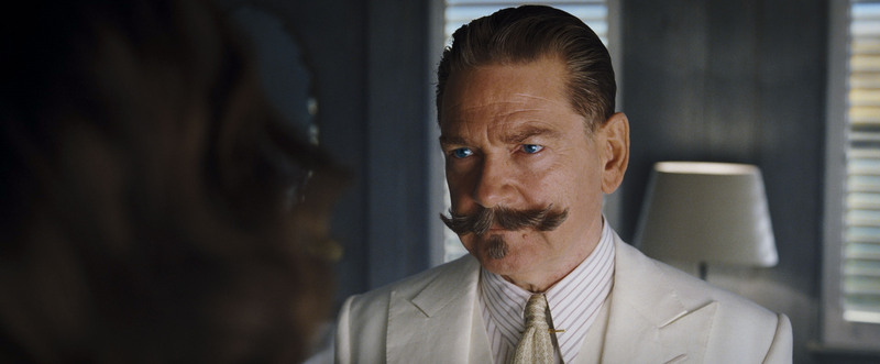 A man with a fabulous mustache scowling in this image from 20th Century Studios