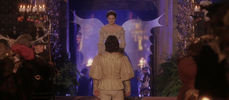 A man gazes up at a woman dressed as an angel in this image from Fox Family Films.
