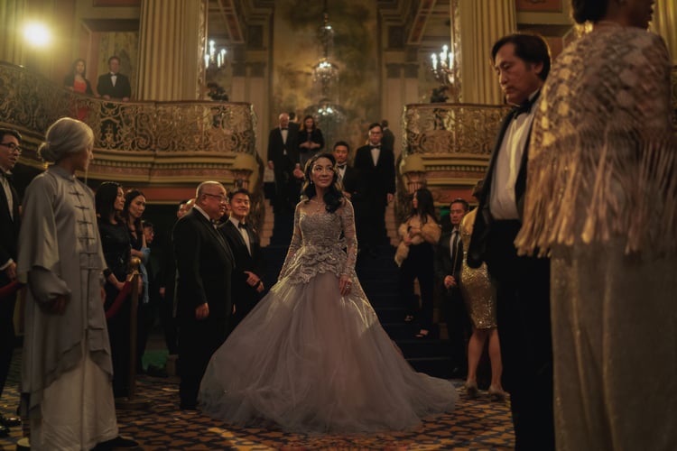 A woman in a ballgown at a formal party in this photo from A24.