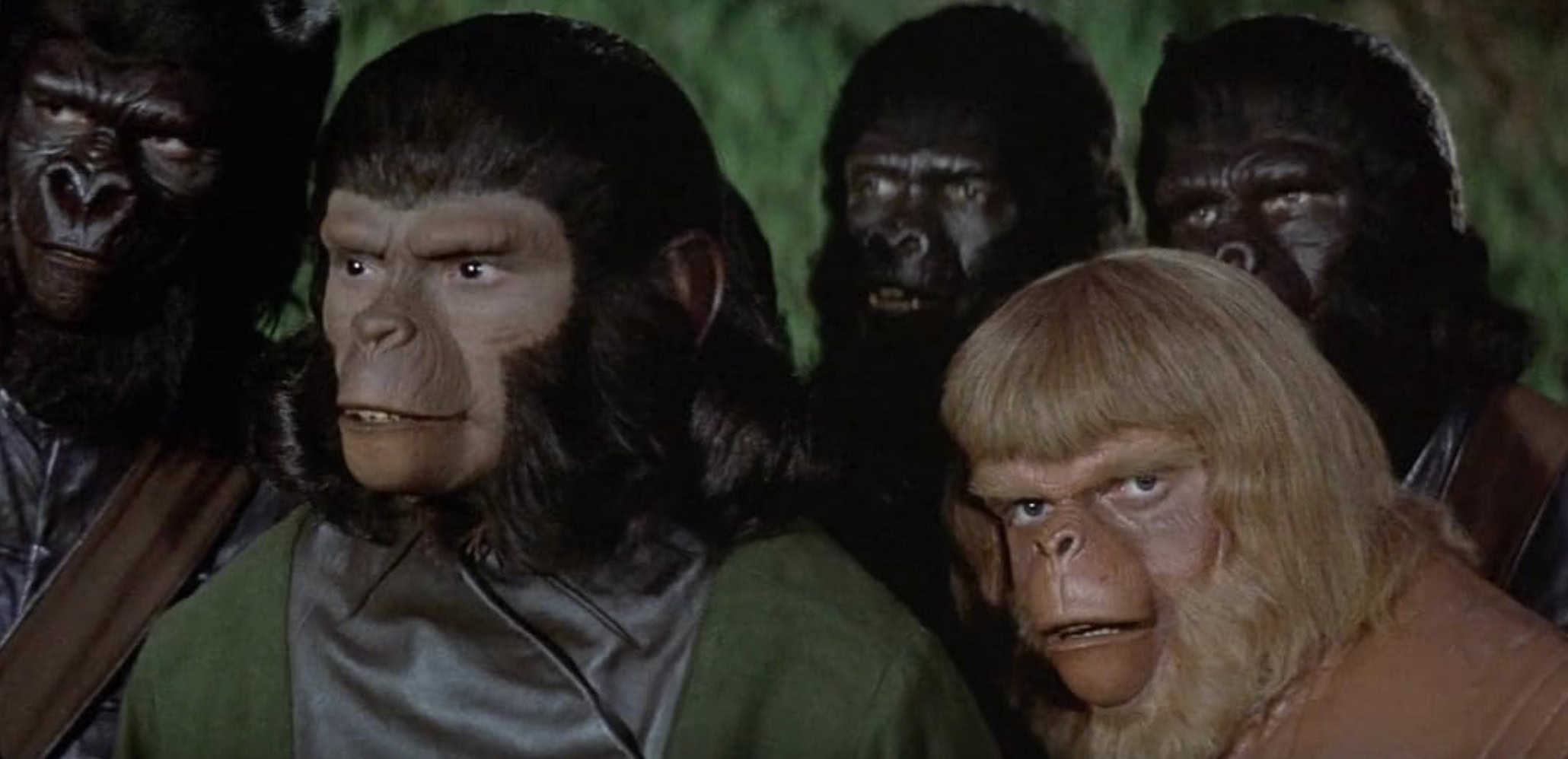 Apes in uniform stand together in this image from APJAC Productions.